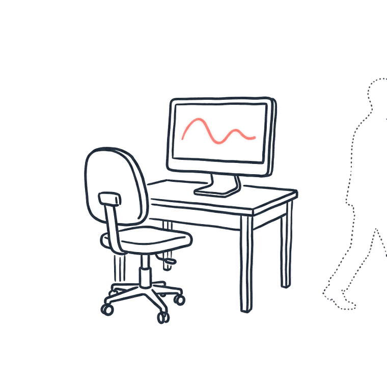An empty office chair at a desk, a faint figure walking away